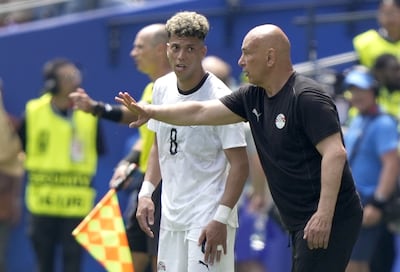 Egypt's head coach Hossam Hassan gives instructions to Emam Ashour. EPA