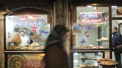 A sweet shop inside Al Madina Souk in Aleppo, Syria, before it was destroyed during the civil war. Getty Images