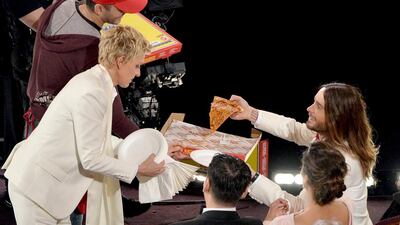 Ellen DeGeneres gives Jared Leto some pizza during the Oscars. Kevin Winter / Getty Images / AFP