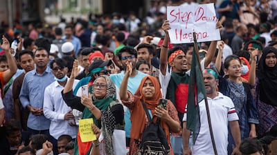 People take part in a protest against Prime Minister Sheikh Hasina and her government. She has now resigned and fled Bangladesh. AP