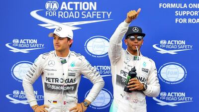 British Formula One driver Lewis Hamilton, right, of Mercedes-GP celebrates as he took pole position followed by second placed German Formula One driver Nico Rosberg, left, of Mercedes-GP at the Monte Carlo circuit in Monaco on Saturday. The 2015 Formula One Grand Prix of Monaco will take place on Sunday. EPA/SRDJAN SUKI