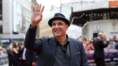 Vinnie Jones poses for photographs as he arrives for the world premiere of The Expendables 3. Paul Hackett / Reuters