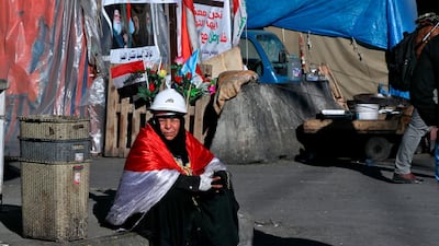 A woman takes part in the ongoing anti-government protests in Tahrir Square, Baghdad. AP Photo