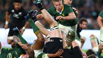 South Africa's Damian Willemse tackles New Zealand's Jordie Barrett. Reuters