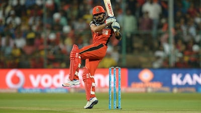 Royal Challengers Bangalore batsman Virat Kohli hits a boundary during the 2016 Indian Premier League(IPL) Twenty20 cricket match between Royal Challengers Bangalore and Sunrisers Hyderabad at The M Chinnaswamy Stadium in Bangalore on April 12, 2016. AFP / MANJUNATH KIRAN