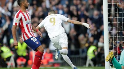Real Madrid's Karim Benzema celebrates after scoring his side's first goal against Atletico Madrid at the Santiago Bernabeu. AP