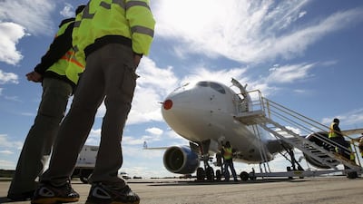 Employees look at the CSeries aircraft after its first test flight in Mirabel, Quebec in 2013. Christinne Muschi / Reuters