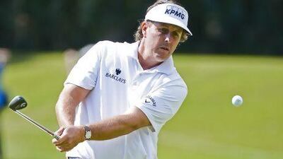 Phil Mickelson, a recent winner at TPC Sawgrass, chips during a practice round on Wednesday. Tannen Maury / EPA