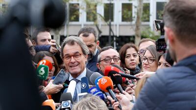 Artur Mas, a former president of Catalonia, talks to journalists outside the national court in Madrid, Spain. Ousted Catalan government members and lawmakers began arriving at two Spanish courts in Madrid to face possible charges of rebellion for having declared the region's independence. Paul White / AP Photo