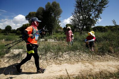 Locals watch a participant in the Super Salmon ultra-marathon. Reuters