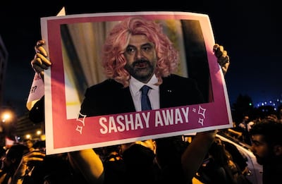 A picture of Prime Minister Saad Hariri at an October 19, 2019 rally in downtown Beirut. "Sashay away" is a catchphrase from a drag queen TV show meaning "leave". Afp