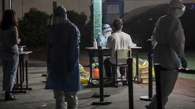 Covid-19 testing is under way at a Shanghai neighbourhood. Bloomberg