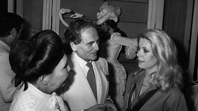 Pierre Cardin with Catherine Deneuve and Rosy Carita during a reception at the Ritz in Paris, in 1978. AFP