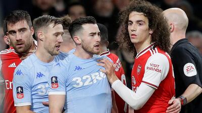 Players argue during the English FA Cup soccer match between Arsenal and Leeds United at the Emirates Stadium. AP