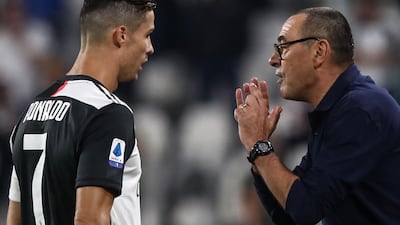 Juventus' Italian coach Maurizio Sarri gives instructions to Juventus' Portuguese forward Cristiano Ronaldo. AFP