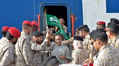 Members of the Saudi Navy assist evacuees. AFP