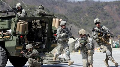 US Army soldiers from the 25th Infantry Division's 2nd Stryker Brigade Combat Team and South Korean soldiers take their positions during a demonstration of the combined arms live-fire exercise. AP, File