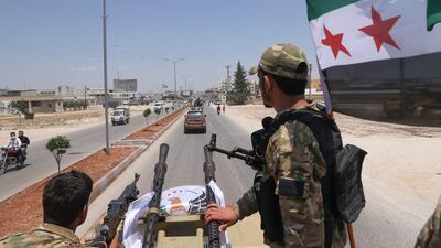 Turkish-backed Syrian rebel fighters take part in a military parade in northern Aleppo, in 2022. AFP