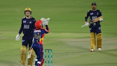 Karachi Kings wicketkeeper Joe Clarke takes a catch of Quetta Gladiators' Tom Banton. AFP