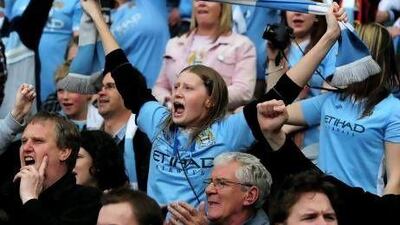 Manchester City fans celebrate after the last-gasp glory was secured.