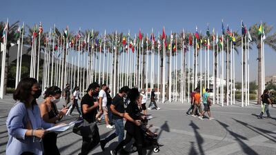 Visitors check maps to plan their visit at the Expo 2020 site in Dubai. Pawan Singh / The National