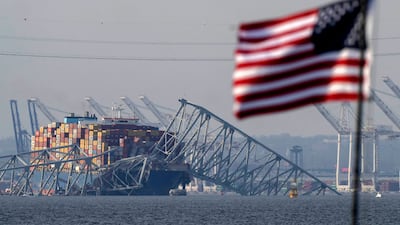 The container ship Dali rests against the wreckage of the Francis Scott Key Bridge in Baltimore, Maryland on Tuesday. The incident looks set have a cascade effect on jobs, businesses, trade and transport not just in the US north-east, but internationally. AP
