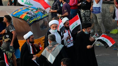 Shiite clerics take part in an anti-government protest during a demonstration in Tahrir Square in Baghdad, Iraq. AP Photo