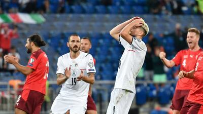 Italy midfielder Jorginho reacts after missing a penalty. AFP
