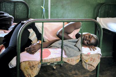 A patient rests on a bed after being discharged from the malaria ward at a health centre in the Kiryandongo refugee settlement, in northwestern Uganda, in April. Esther Mababzi / AFP