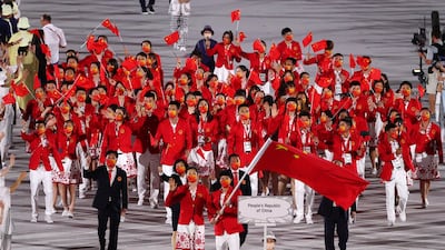 Flag Bearers of People's Republic of China Ting Zhu and Shuai Zhao lead a delegation during the Opening Ceremony.