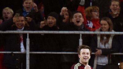 Russia's Oleg Kuzmin celebrates after scoring in a Euro 2016 qualifying win over Montenegro on Monday night. Kirill Kudryavtsev / AFP / October 12, 2015