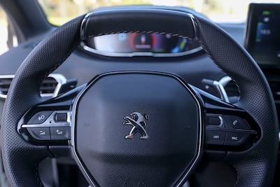The cabin is elegant and the tiny steering wheel is nice to hold, but obscures most of the instrument cluster. Khushnum Bhandari / The National