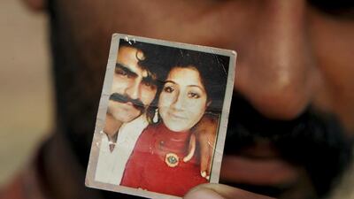 Mohammed Tofeeq shows a picture with his wife Muqadas Tofeeq, who local police say was killed by her mother in Butrawala village on the outskirts of Gujranwala, Pakistan. In recent months there has been a growing outrage at the practice as a proliferation of Pakistani news channels has lifted the shroud of secrecy from the practice of killing in the name of 'honour'. KM Chaudary/AP Photo