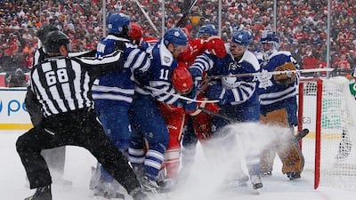 A mad scramble in front of Jonathan Bernier #45 of the Toronto Maple Leafs leads to a snow storm in the second period during the NHL Winter Classic at Michigan Stadium on Wednesday in Ann Arbor, Michigan. Gregory Shamus/Getty Images