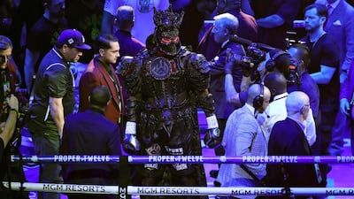 Deontay Wilder enters the ring prior to the Heavyweight bout wearing a design by Cosmo & Donato. AFP