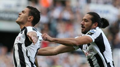 Newcastle's Hatem Ben Arfa celebrates with Jonas Gutierrrez scoring his team's equaliser against Aston Villa at the Sports Direct Stadium. Lindsey Parnaby/AFP