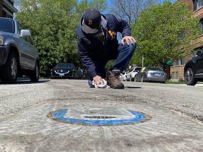Chicago artist Jim Bachor at work on a Chicago street. Reuters