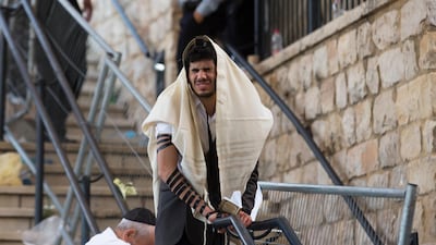 An Orthodox Jew prays after after dozens killed in a crush at the Lag BaOmer religious festival in Mount Meron. Getty Images