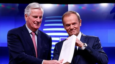 The EU's chief Brexit negotiator Michel Barnier hands over the draft agreement to European Council President Donald Tusk in Brussels on November 15, 2018. Reuters