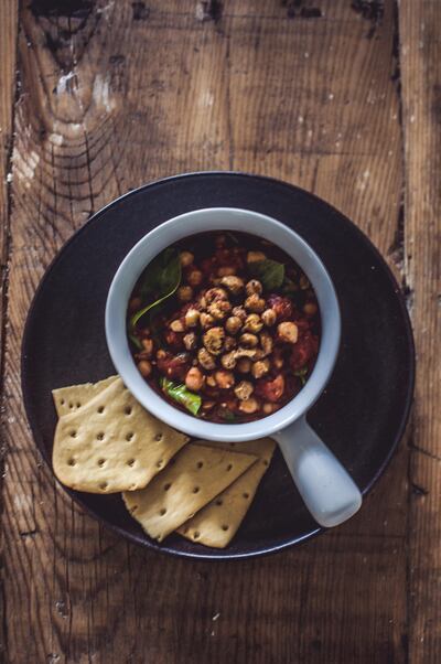 Chickpea, tomato and spinach stew with crispy chickpea croutons. Photo by Scott Price