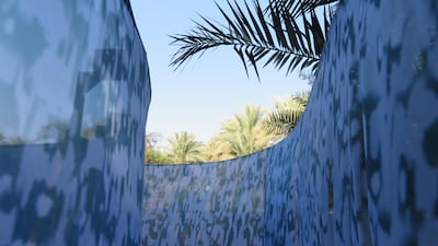 Manal Al Dowayan's fabric installation, You Are From Me and I Am From You, in Al Ain Oasis. Courtesy Abu Dhabi Art