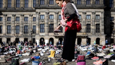 Children's shoes are assembled on Dam Square, Amsterdam, during a memorial protest highlighting the number of child victims of the Gaza war. AFP