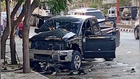 A car damaged in the explosion near the Sayyida Zaynab shrine, in Damascus. Photo: X