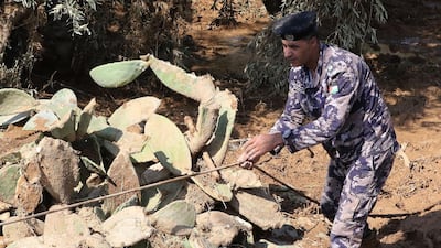 A member of Jordanian rescue team searches for missing people after flash floods in Madaba on November 10, 2018. AFP
