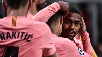Malcom celebrates with teammates after scoring. AFP