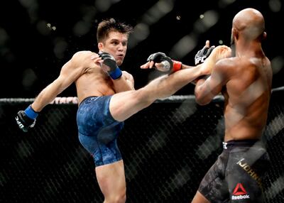 Henry Cejudo, left, kicks Demetrious Johnson during his victory at UFC 227 in Los Angeles in 2018. AP