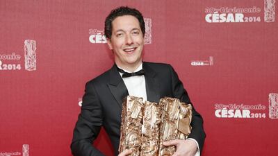 French actor and director Guillaume Gallienne poses with four of his five trophies after winning Best Film, Best First Film, Best Adaptation, Best Actor and Best Film Editing, for his film ‘Les Garcons et Guillaume, a table.’ Ian Langsdon / EPA