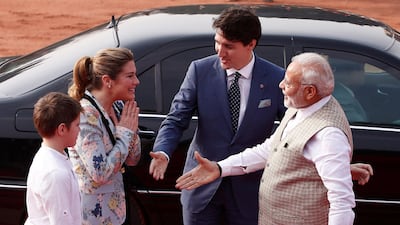 Mr Modi extends his hand to Mr Trudeau's wife, Sophie. Adnan Abidi / Reuters