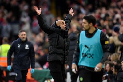 Pep Guardiola gestures towards the Liverpool fans. AFP