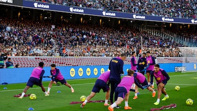 Barcelona players attend a public training session at the remodeled Camp Nou. EPA